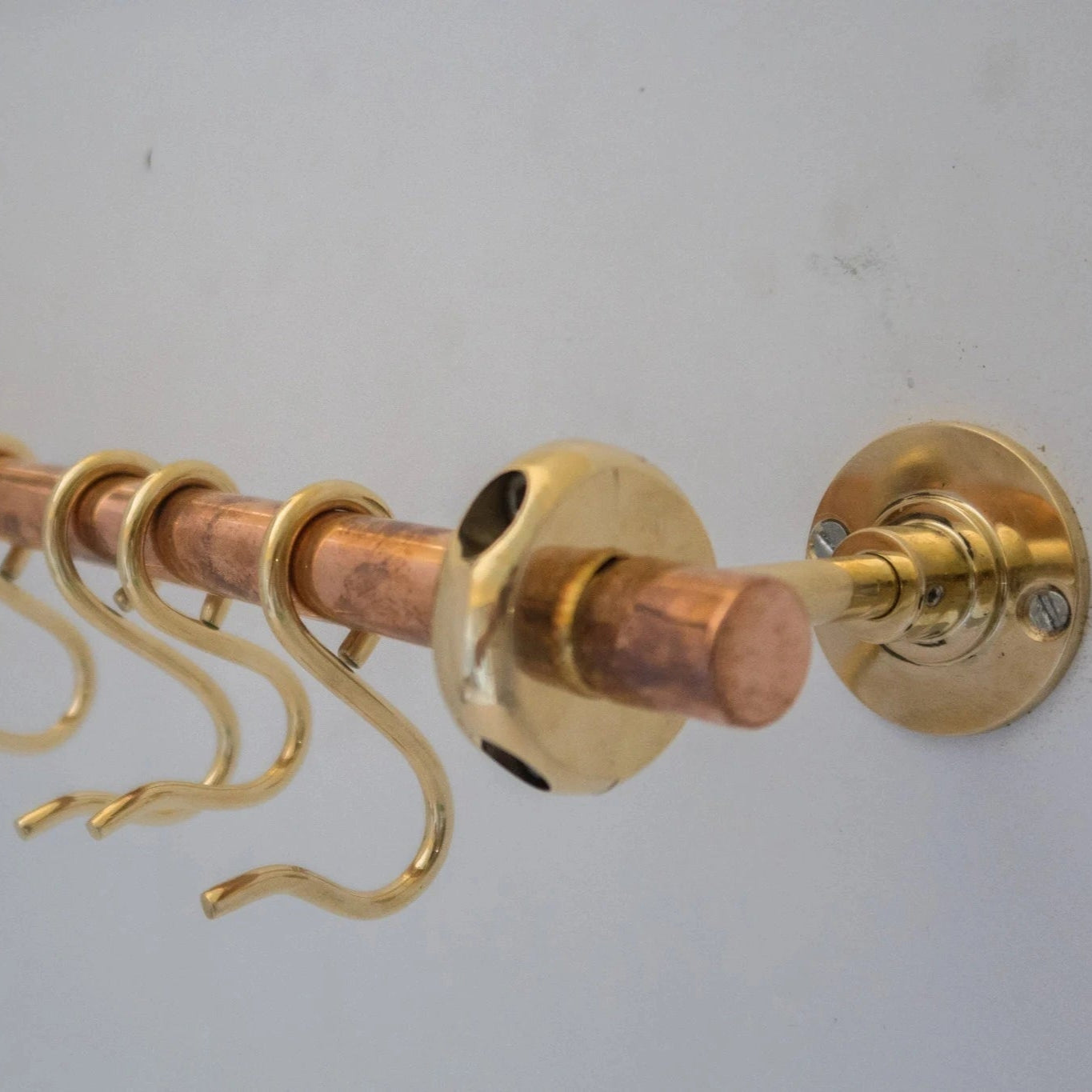 Unlacquered brass and copper wall-mounted kitchen rod with S-hooks for utensils – Atlas Finest