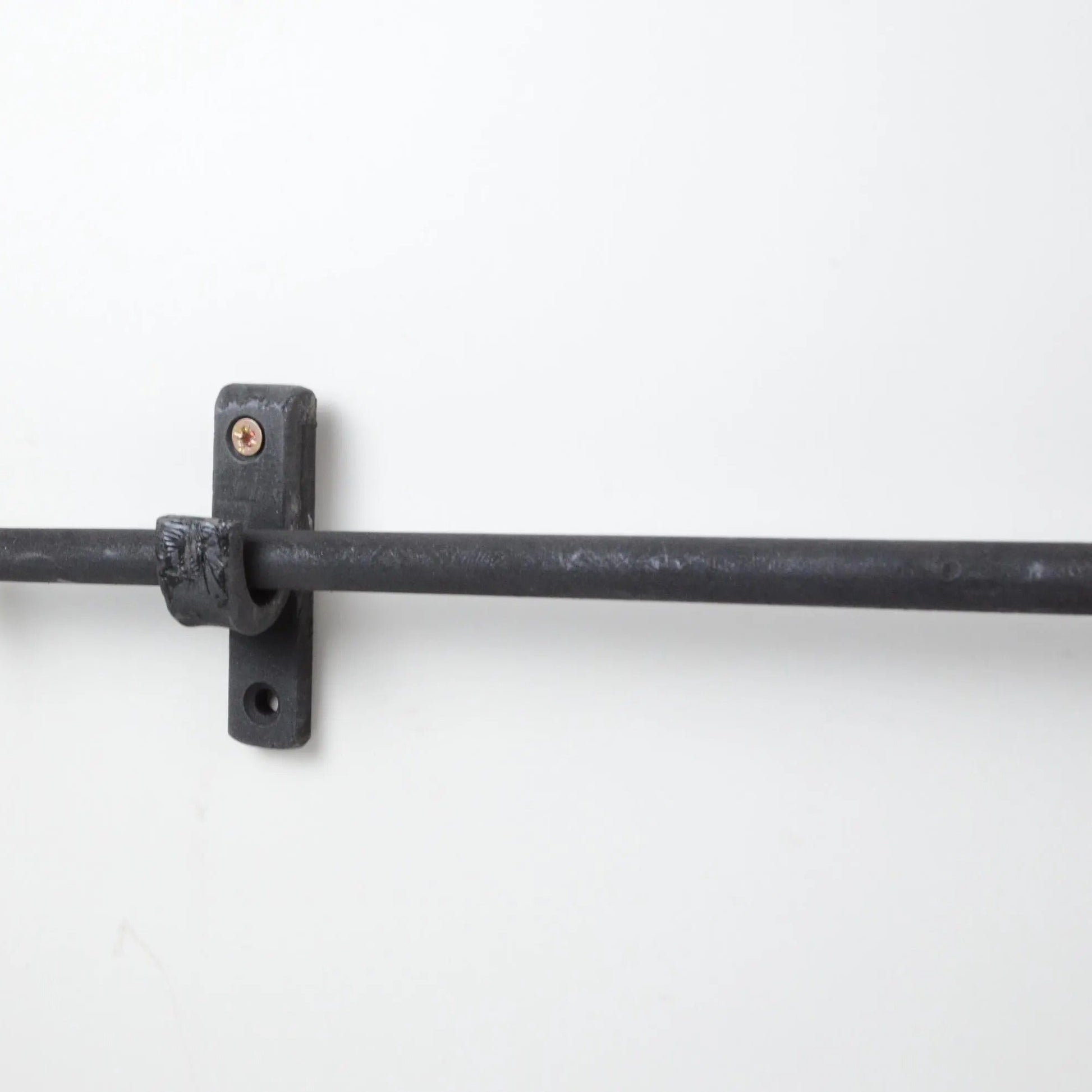 Matte Black Wrought Iron Curtain Rod with Wall-Mounted Bracket for Rustic and Industrial Interiors – Atlas Finest