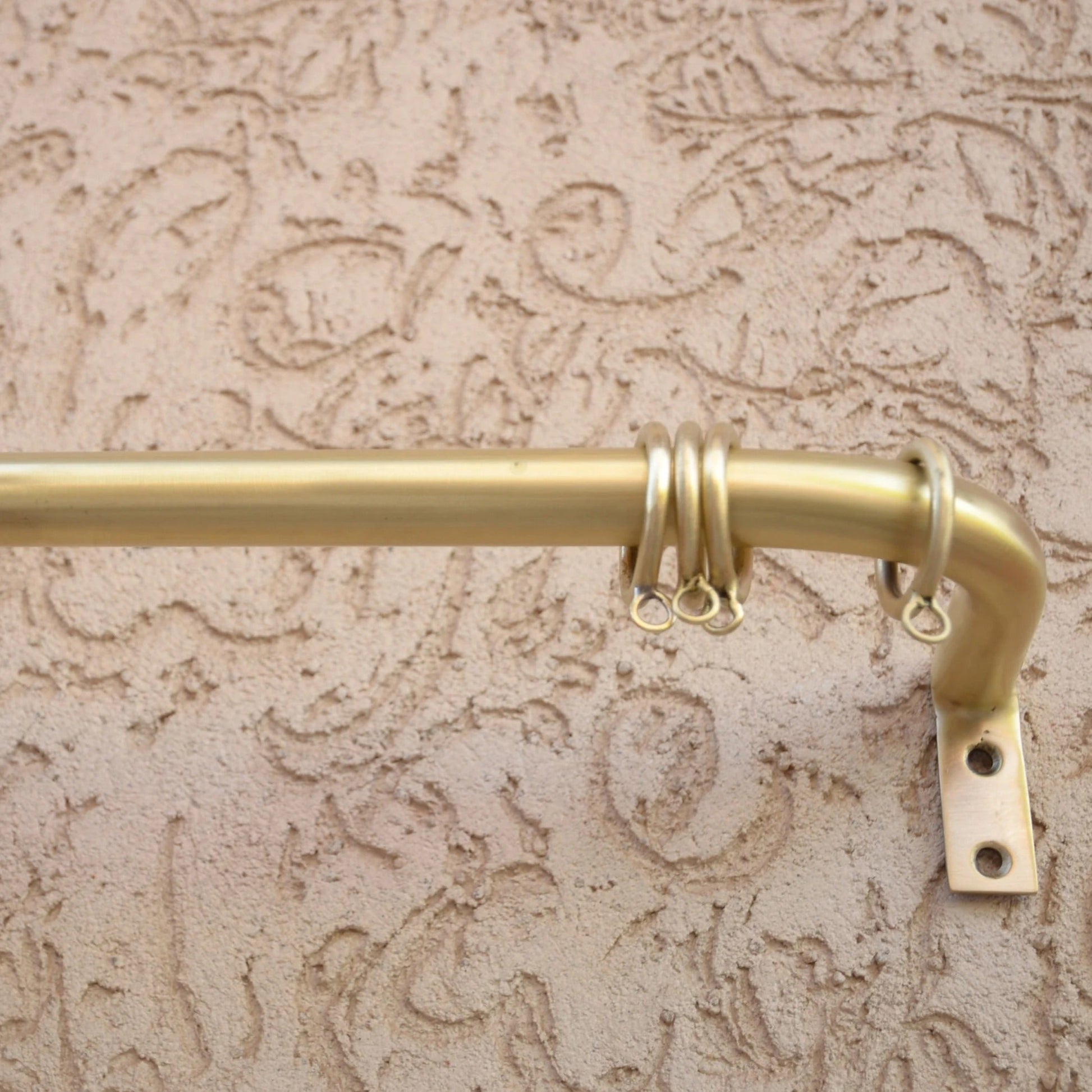 Wall-mounted unlacquered brass curtain rod with rings for modern window styling – Atlas Finest hardware