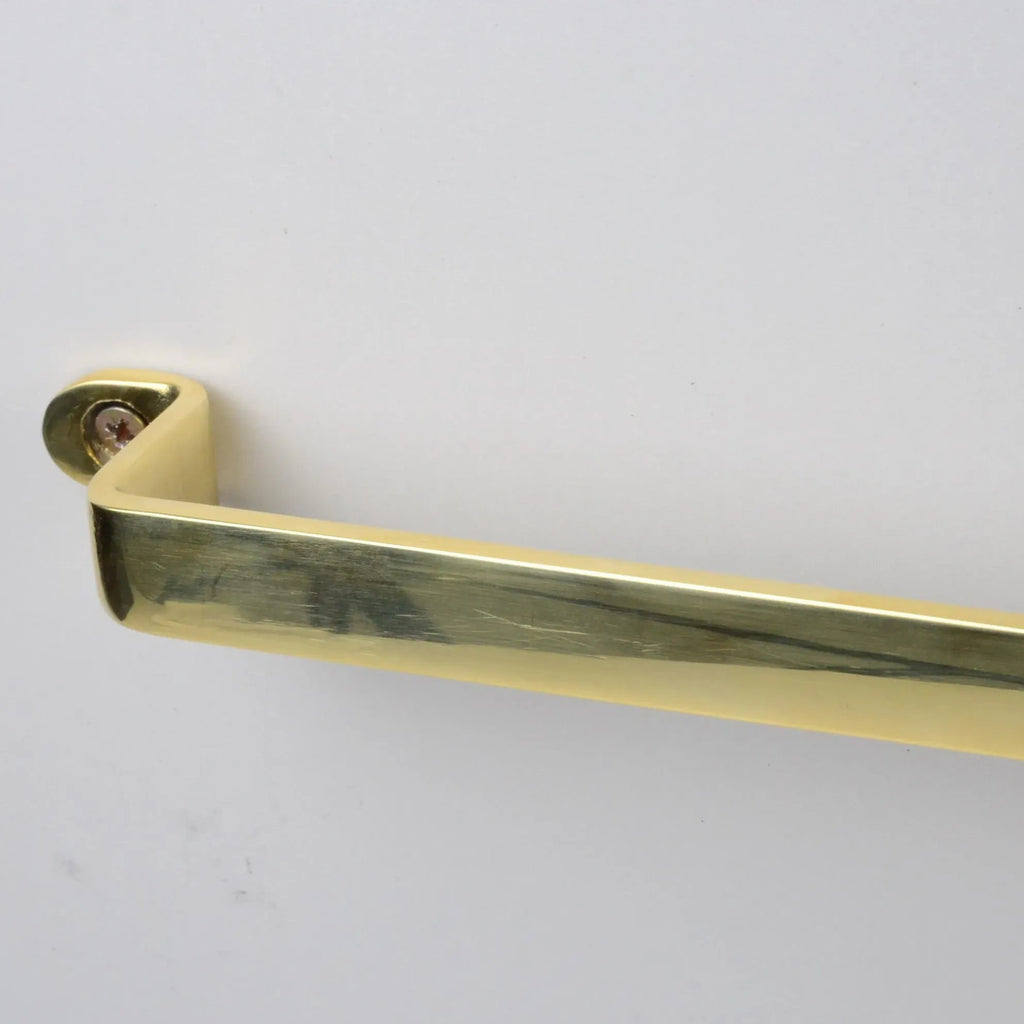 Close-up of flat unlacquered brass pot rack wall mount bracket – Atlas Finest
