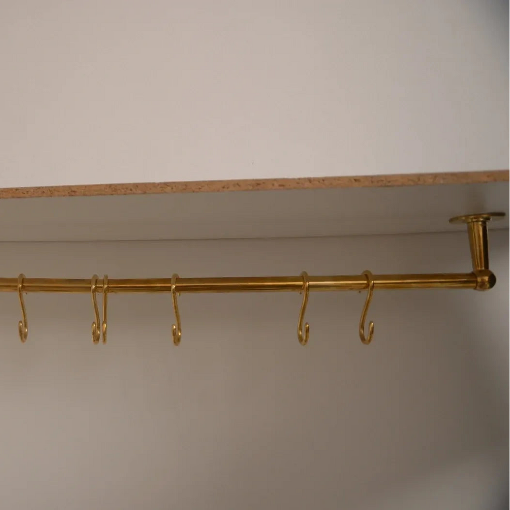 Long ceiling-mounted unlacquered brass kitchen rod with multiple S-hooks for utensils – Atlas Finest