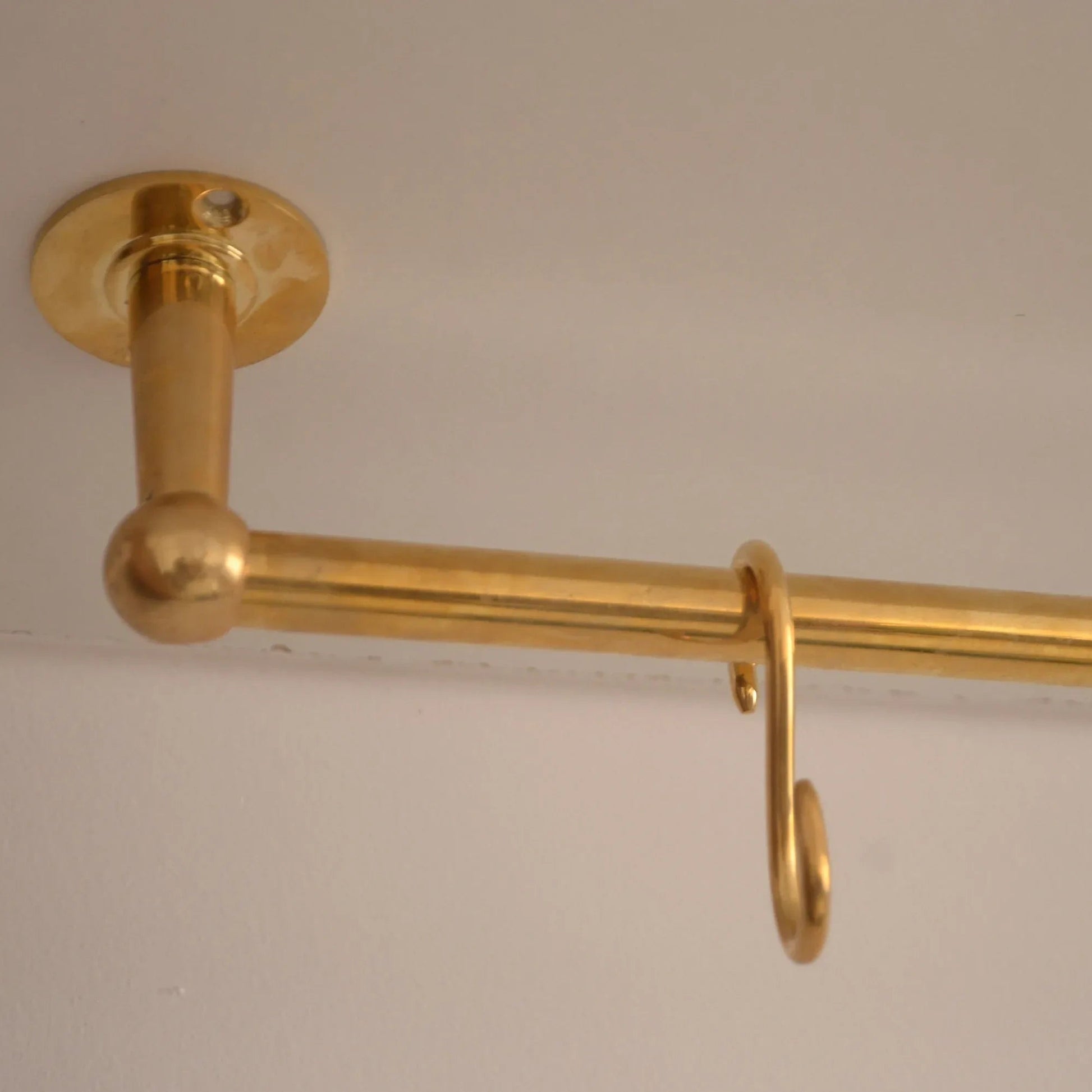 Unlacquered brass ceiling-mounted kitchen rod with single S-hook for hanging utensils – Atlas Finest