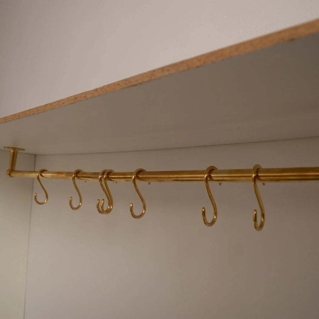 Minimalist unlacquered brass S-hooks on copper kitchen rod – Atlas Finest