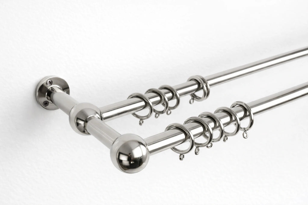 Curtain rod with multiple hooks on a white background