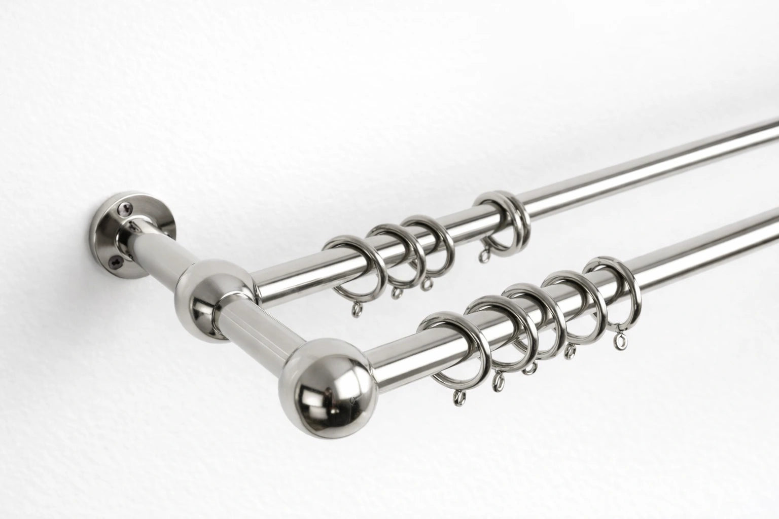 Curtain rod with multiple hooks on a white background