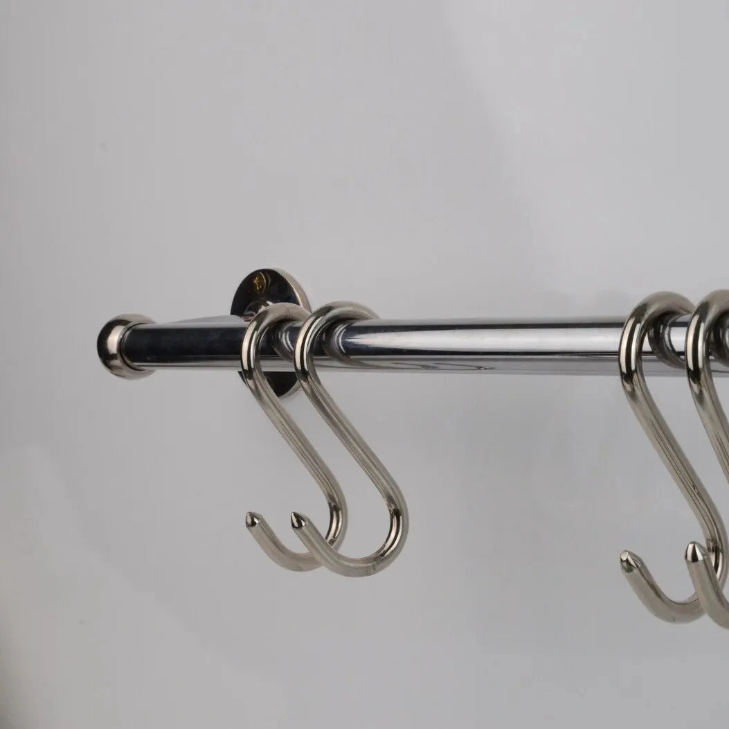 Polished chrome pot rail made from solid brass, featuring four hanging hooks, perfect for stylish kitchen organization and modern storage solutions