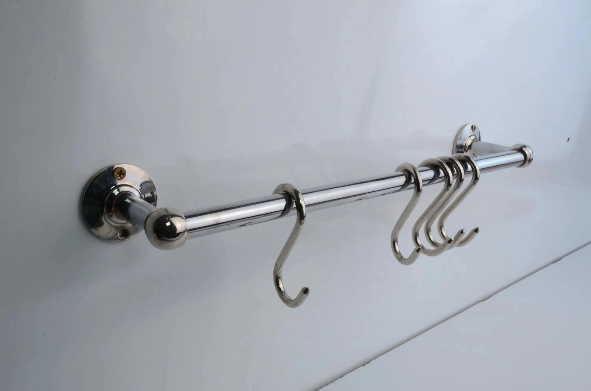 Elegant chrome pot rail bar crafted from solid brass, polished chrome finish with four sturdy hooks, ideal for maximizing kitchen organization space