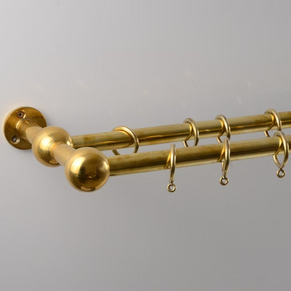 Polished brass double curtain rod with rings for elegant window treatments – Atlas Finest premium hardware