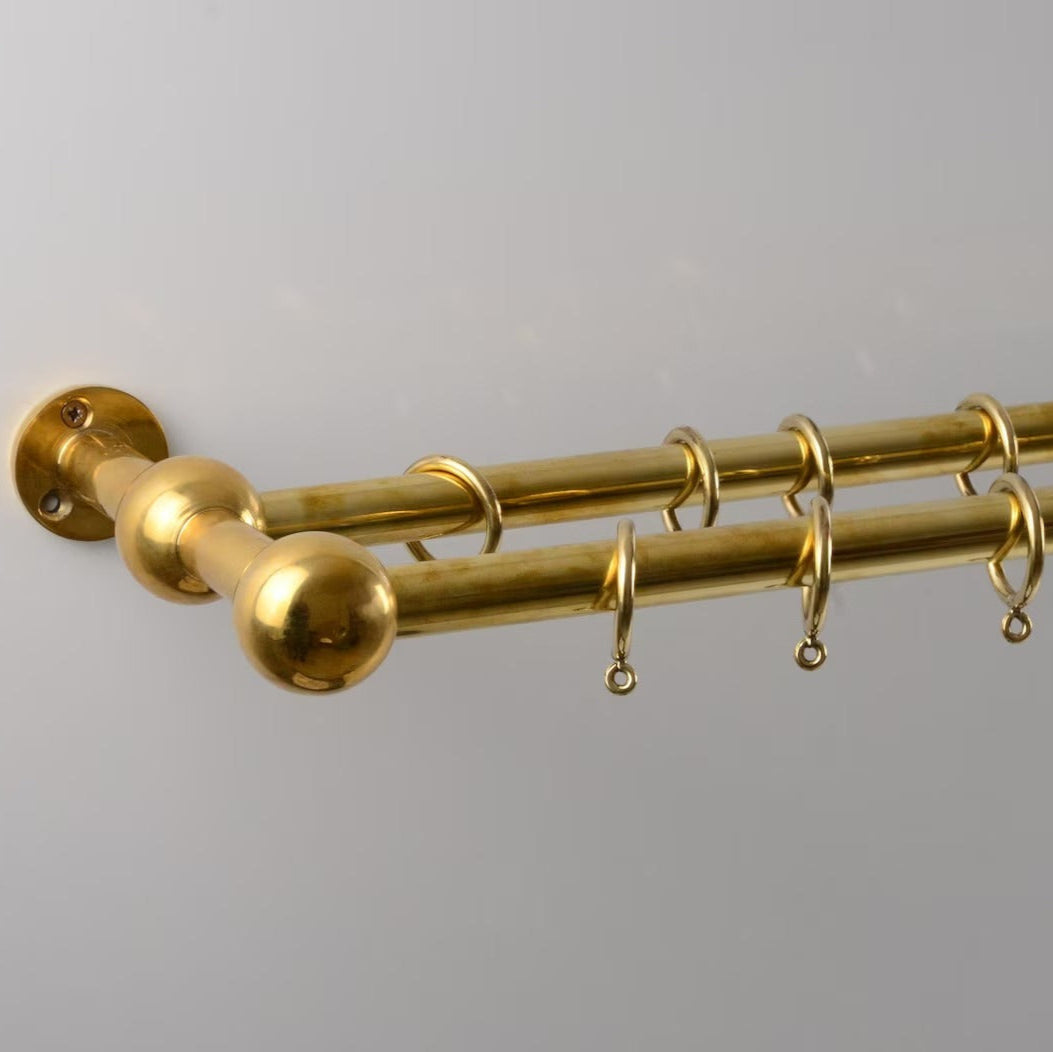 Polished brass double curtain rod with rings for elegant window treatments – Atlas Finest premium hardware