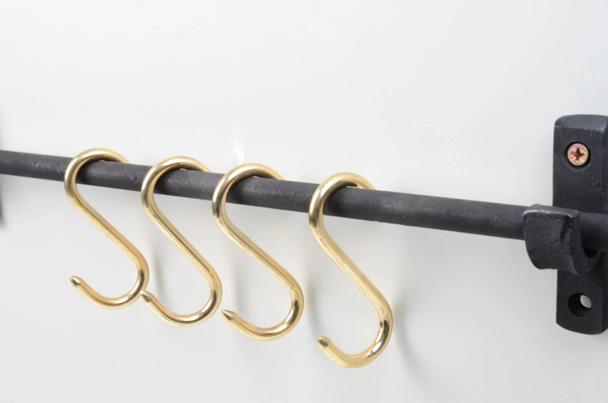 Elegant iron kitchen rail with brass S-hooks for hanging pots and utensils – Atlas Finest