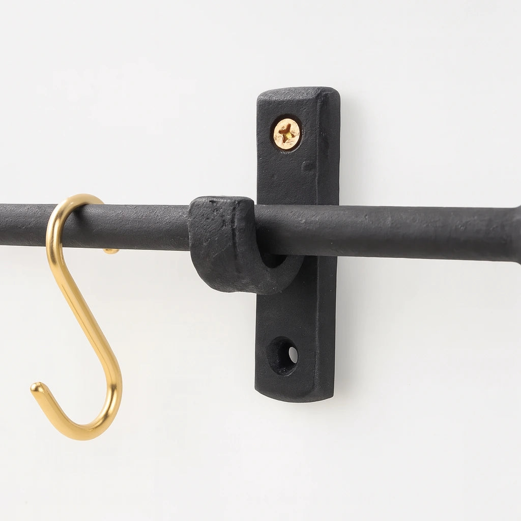 Black iron wall-mounted pot rack with brass S-hooks for modern kitchen organization – Atlas Finest