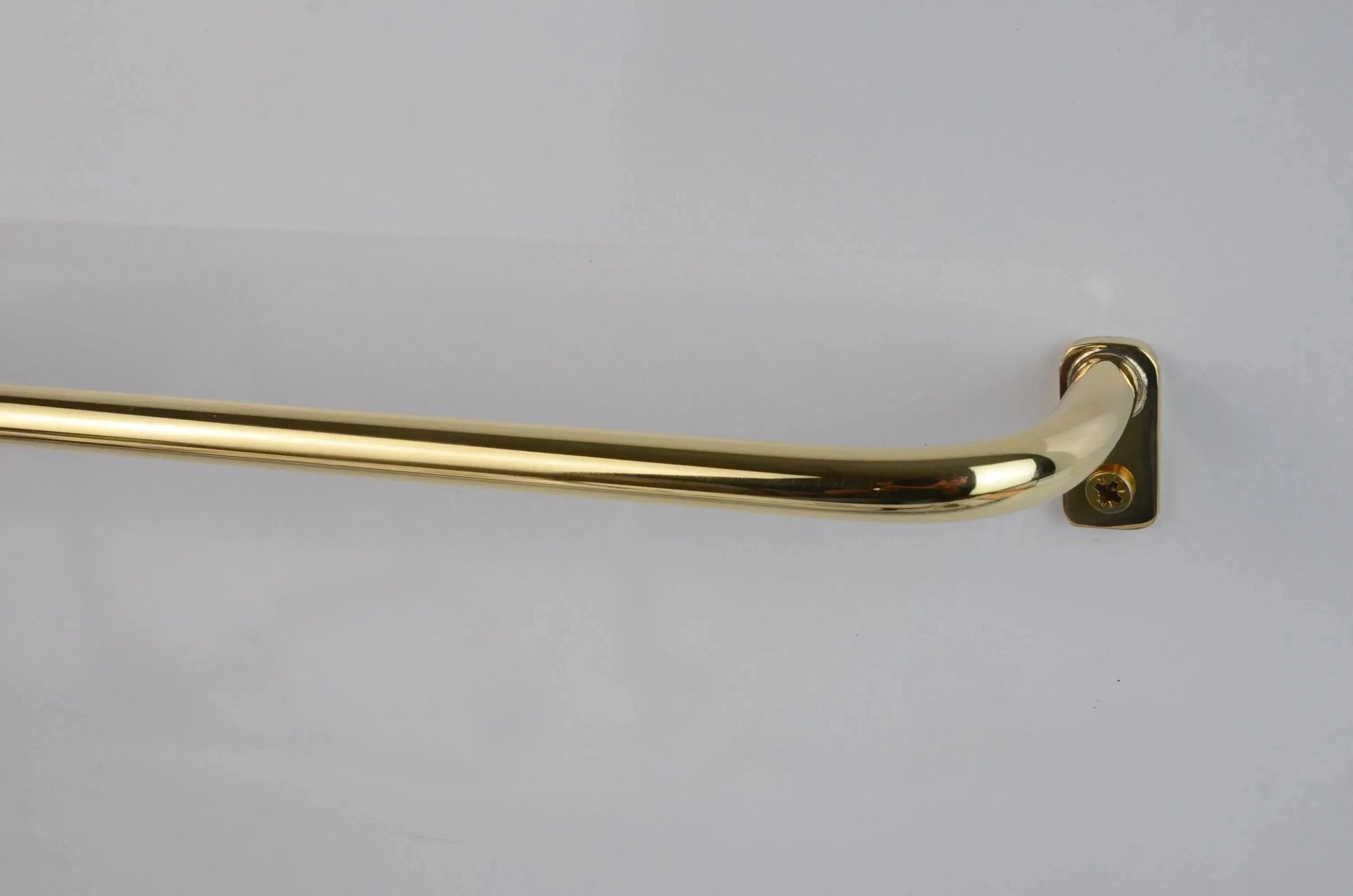 Thin French return brass drapery rod, polished unlacquered finish, modern wall mount