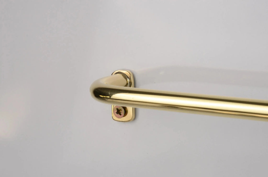 unlacquered brass café drapery rod with curved French return brackets