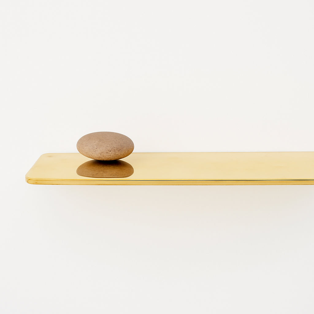 Unlacquered brass floating shelf