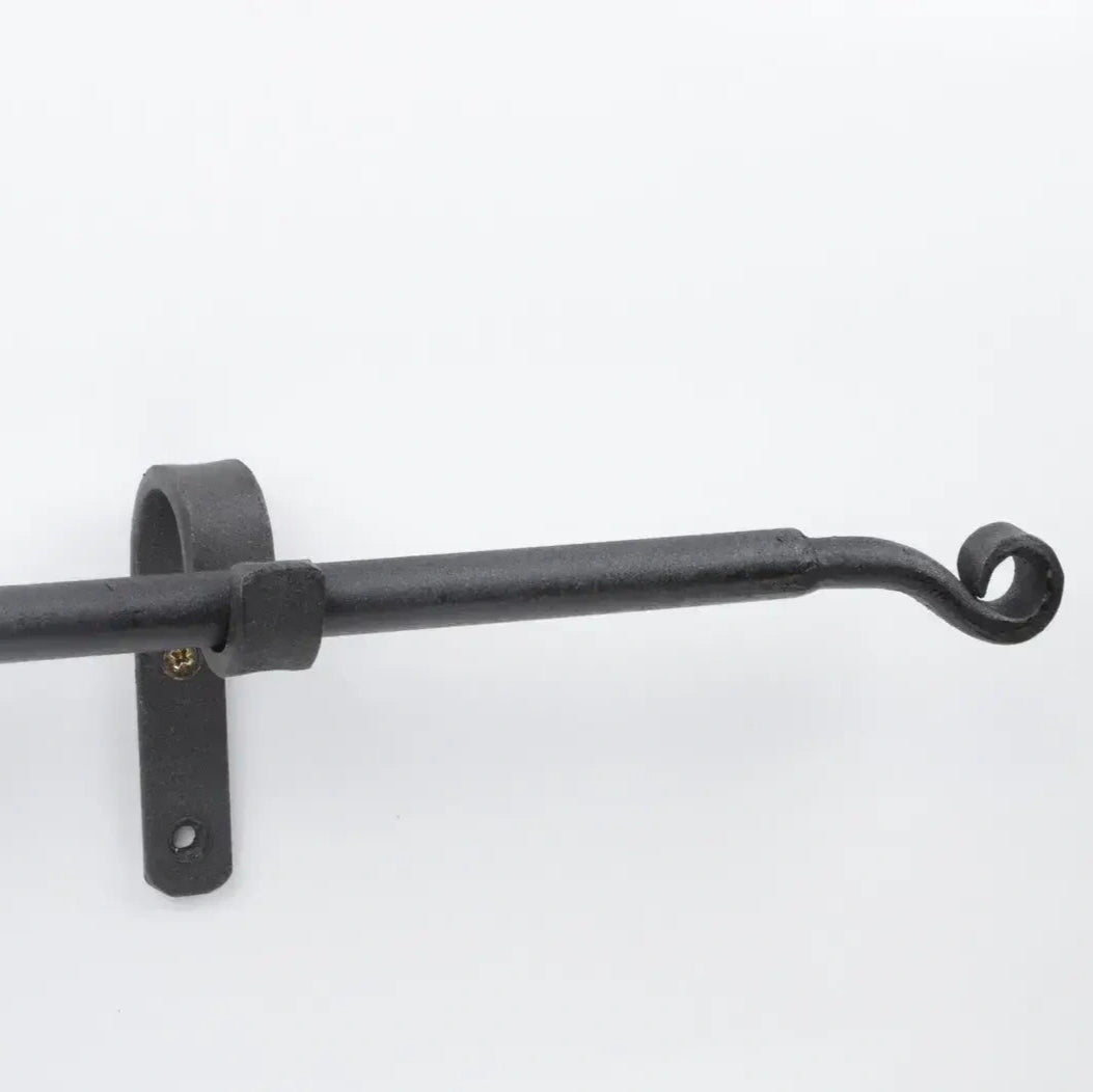 Wall-mounted black curtain pole in wrought iron finish