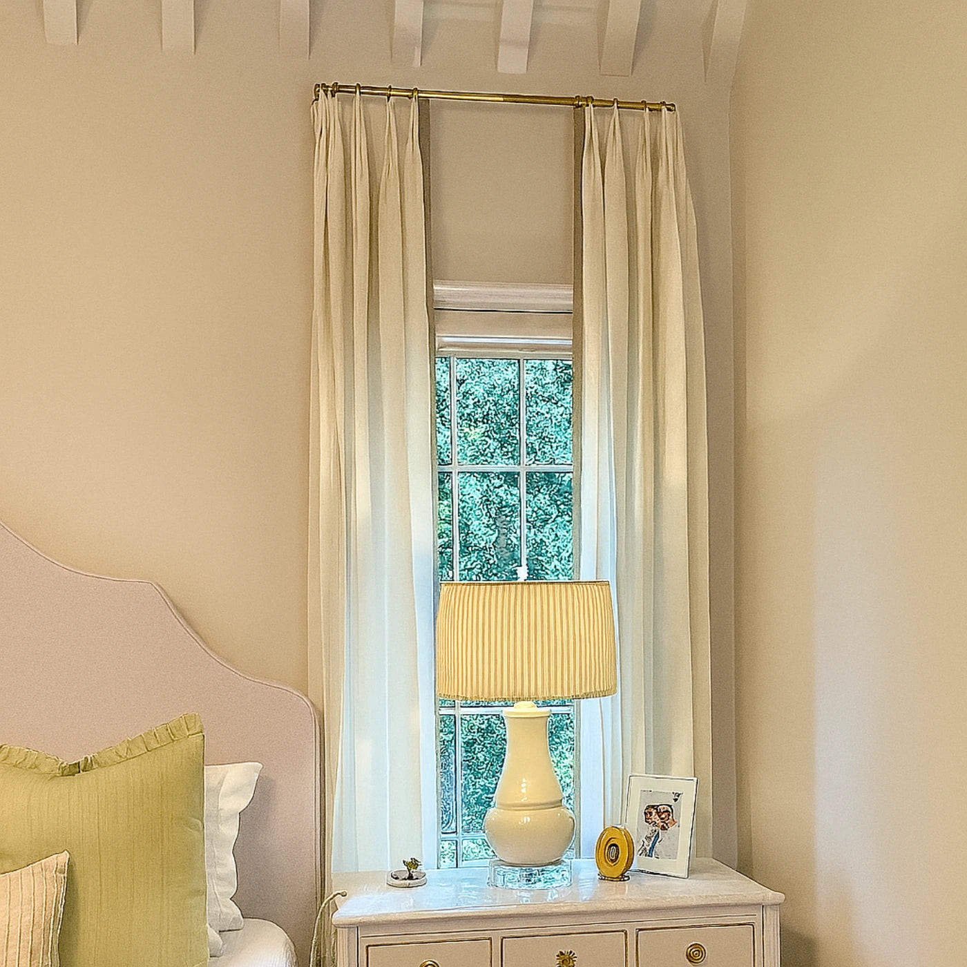 Elegant bedroom with unlacquered brass curtain rod and flowing white drapes – Atlas Finest décor
