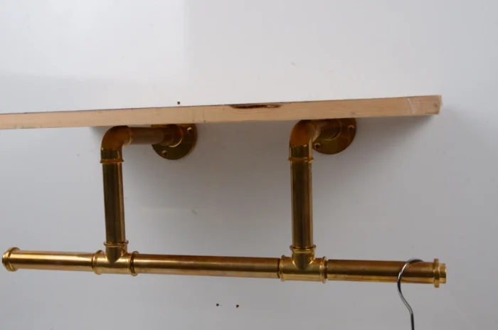 unlacquered brass wall-mounted clothes rack