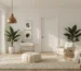 Modern living room with Atlas Finest unlacquered brass pendant light, neutral decor, and indoor plants.
