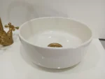 Ceramic sink with a drain