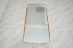 Unlacquered brass mirror