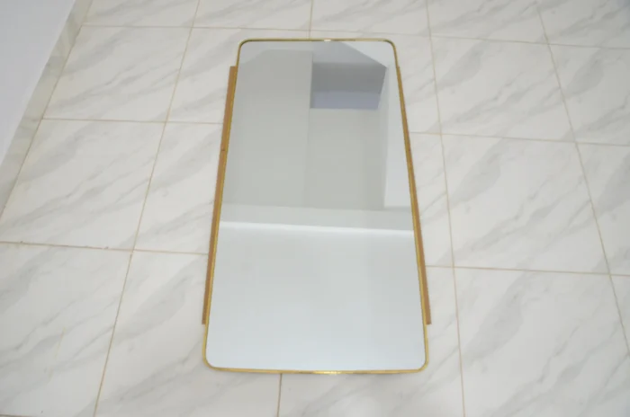 Unlacquered brass mirror